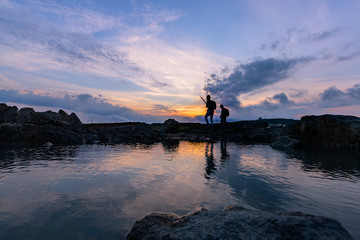 The Sea  of heads of hills, rocks singular, spray flying