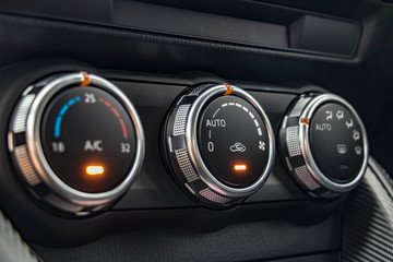 Air conditioning controls on the car dashboard. Close up car ventilation system, details of...