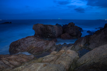 The Sea  of heads of hills, rocks singular, spray flying