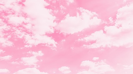 Pink sky background with soft delicate white clouds. Copy space. Romantic 16:9 panoramic background