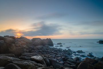 The Sea  of heads of hills, rocks singular, spray flying