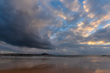 The Sea  of heads of hills, rocks singular, spray flying
