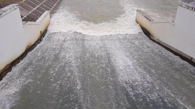 view of water rushing through the gates at dam where is the hydropower electrical generation PHETBURI,THAILAND