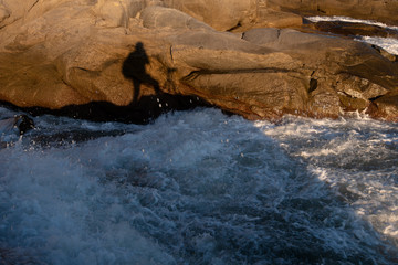 The island in the sea, the tide against the reef, the reef appears golden at dusk