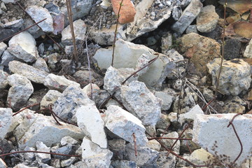 Construction waste with elements of and destroyed old structures at municipal landfill