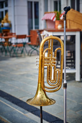 Street scene with the trumpet owned by a street musician.