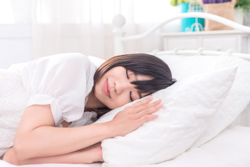 Fototapeta na wymiar Portrait of beautiful asian young woman sleep lying in bed with head on pillow comfortable and happy with leisure, girl with relax for health and lifestyle concept.
