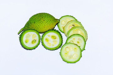 Fresh green colorful spiny gourd vegetables on white background.