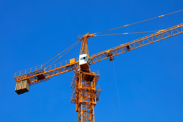 The tower crane is on the construction site.