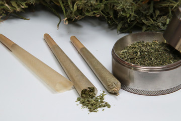 marijuana joints and buds on the white table