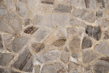 The wall is made of cobblestone masonry. Structure, architecture.