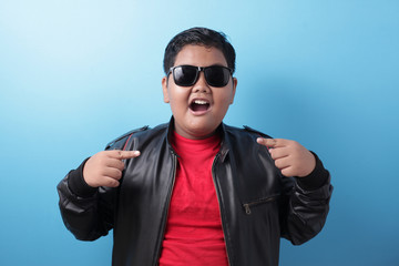 Asian fat boy pointing himself with unhappy displeased expression