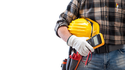 Electrician holds multimeter tester in hand, helmet with protective goggles. Construction industry, electrical system. Isolated on a white background.