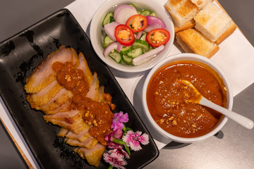 Pork satay grilled with Thai spices and peanut sauce and toast in the restaurant.