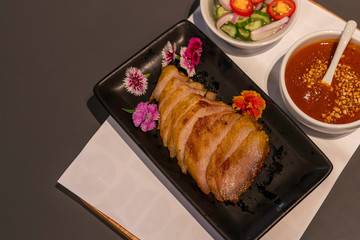 Pork satay grilled with Thai spices and peanut sauce and toast in the restaurant.