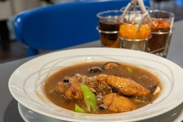 Noodles topped with Soy Sauce and Fish Sea Bass.