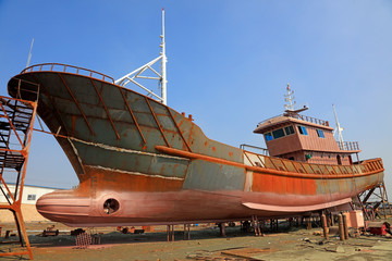 ship under construction in a shipyard