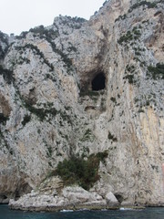 Fototapeta na wymiar View of the cave and cliff near Emperor Tiberius' Villa Jovis, which is believed to have been an execution spot, on Capri, Italy