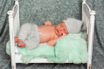 sleeping newborn baby in bright wrap. concept of happiness. place under the text