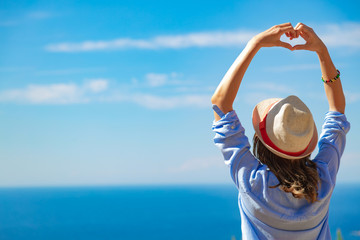 Woman in summertime with tropical ocean scenery.