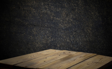 Wood table and black concrete wall background. can be used to install the product..