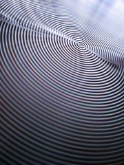 Bottom of metal frying pan, kitchen utensil detail background.