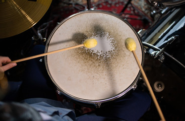Fototapeta na wymiar chopsticks above the drum shot from above
