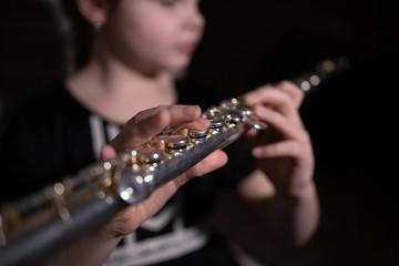girl playing the flute © Robert