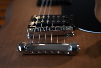 Fototapeta na wymiar close-up of guitar strings, guitar on black background
