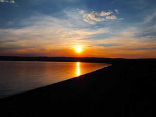 Fototapeta na wymiar Sunset on the water at Yellowstone Lake