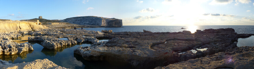 Fototapeta na wymiar Panoramic view of the cliffs and where the Azure Window was, and with its natural surroundings. Dwejra. Gozo, Malta