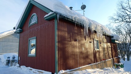 A typical house in a snowy village in the north