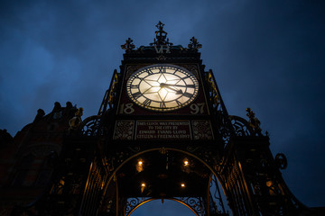 Fototapeta na wymiar Old clocktower lit up at night 
