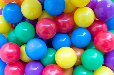 Fototapeta na wymiar Many colorful plastic balls in a playground.