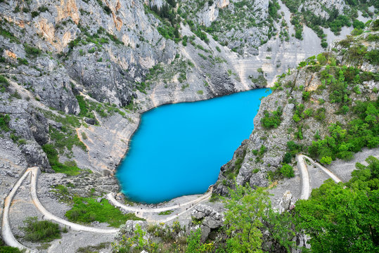 Blue Lake (Modro Jezero) In The Crater Of An Extinct Volcano In Croatia.