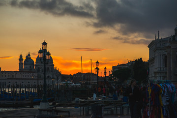 Obraz premium View of the Grand Canal and Basilica di Santa Maria della Salute in Venice during sunset.