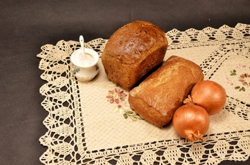 bread and wheat on wooden table