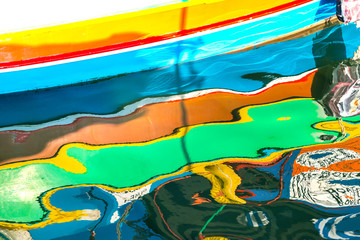 Harbour water reflexion. Abstract image of colorful boats mirroring in the water..