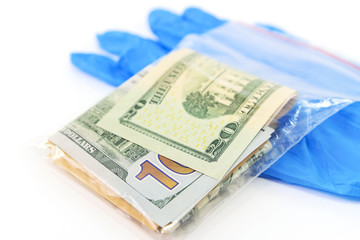 Plastic bag with money and medical gloves