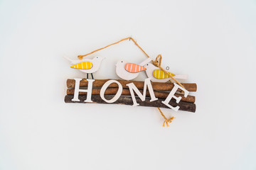Wooden home sign with bird figures