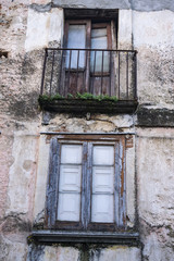 Fototapeta na wymiar crumbling and abandoned windows