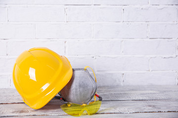 A protective helmet and dust mask is necessary on any construction site.