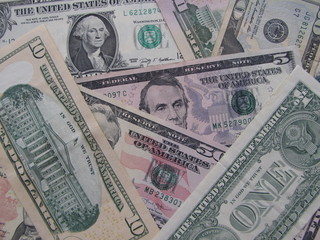 Background of differenet US dollar bills.
