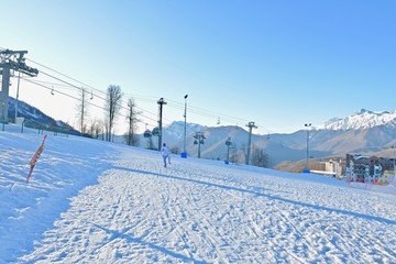  vacationers on a plateau of a ski resort during sunset