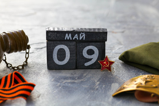 Flask, Gergiev ribbon, cap, army belt with the image of a sickle ,  hammer and wooden calendar with the date May 09.