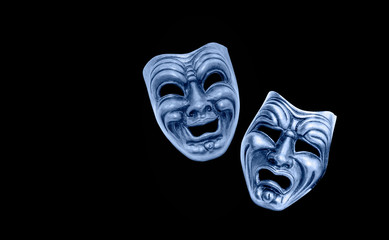 Comedy and Tragedy theatrical venetian mask isolated black background