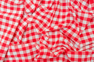 Red checkered kitchen towel. Beautiful decorative folds.