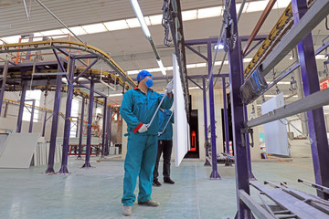 Fototapeta premium Busy workers on production lines, Luannan County, Hebei Province, China