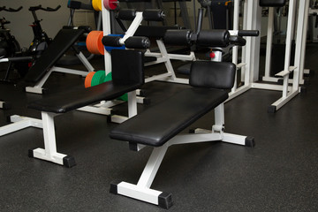 Fototapeta na wymiar Gym equipment and dumbbells for fitness classes in the gym.