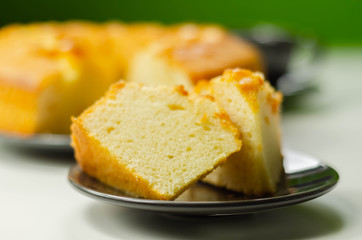 Portion of Madeira ring loaf cake served on a small plate
